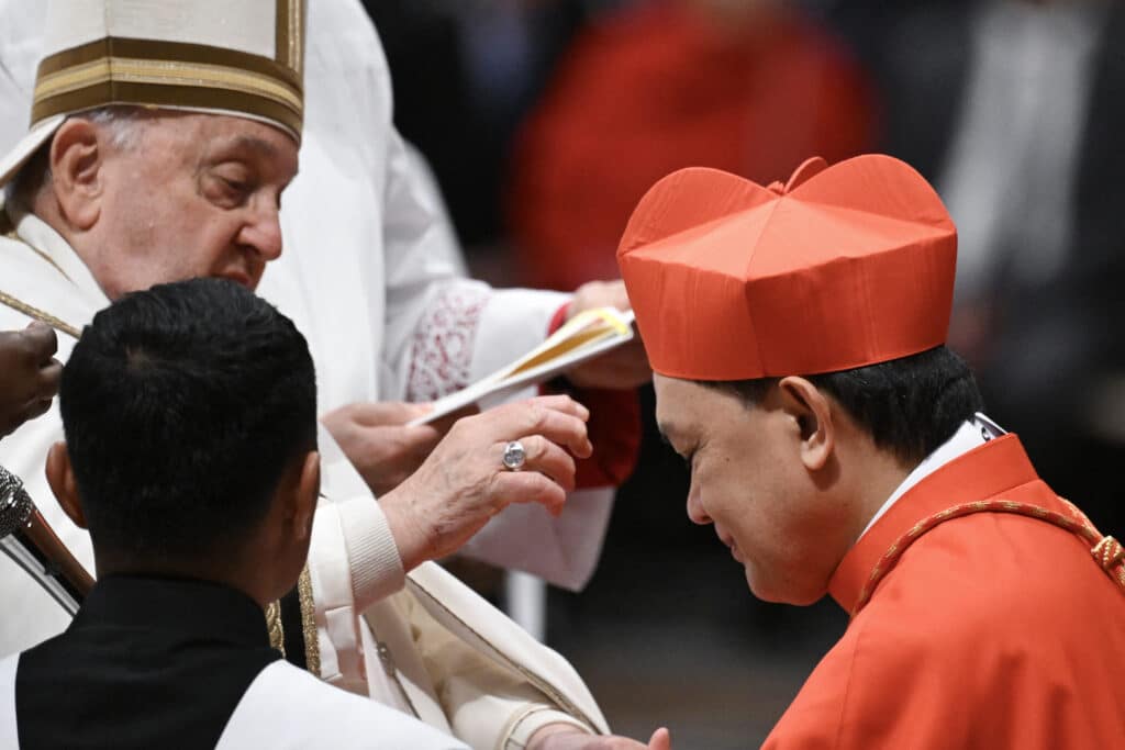 10th cardinal of PH is Kalookan bishop, drug war critic. In photo is Pope Francis placing the biretta upon the head of newly-appointed Filipino cardinal Pablo Virgilio Siongco David during an Ordinary Public Consistory for the creation of new cardinals, at St Peter's Basilica in the Vatican, on December 7, 2024. |Photo by Tiziana FABI / AFP