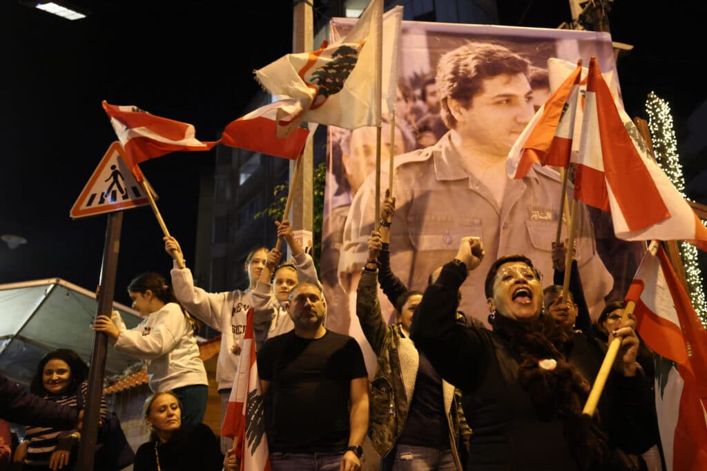 Syria rebels' lightning offensive: 11 days to the fall of Damascus. Supporters of the Christian Phalange party and the Lebanese Forces Party gather to celebrate in Beirut's neighbourhood of Achrafieh on December 8, 2024, after Islamist-led rebels declared that they have taken the Syrian capital. | Photo by IBRAHIM AMRO / AFP