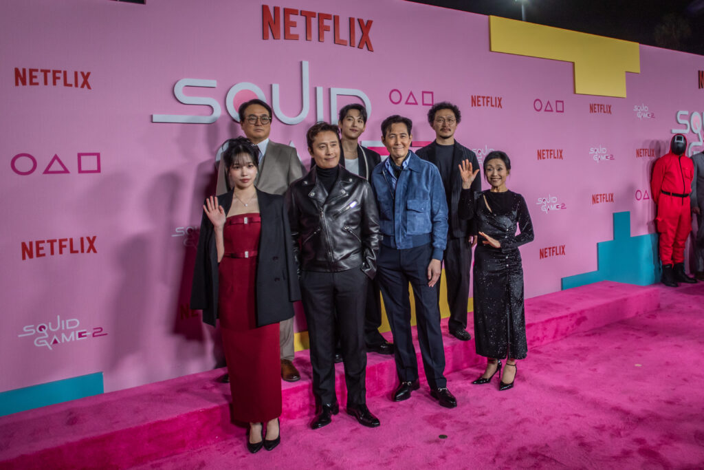 (L-R) South Korean actors Jo Yu-ri, Lee Seo-hwan, Lee Byung-hun, Yim Si-wan, Lee Jung-jae, Yang Dong-geun and Kang Ae-shim attend Netflix's "Squid Game: Season 2" LA premiere and fan event at Los Angeles City College on December 12, 2024. (Photo by Apu GOMES / AFP)