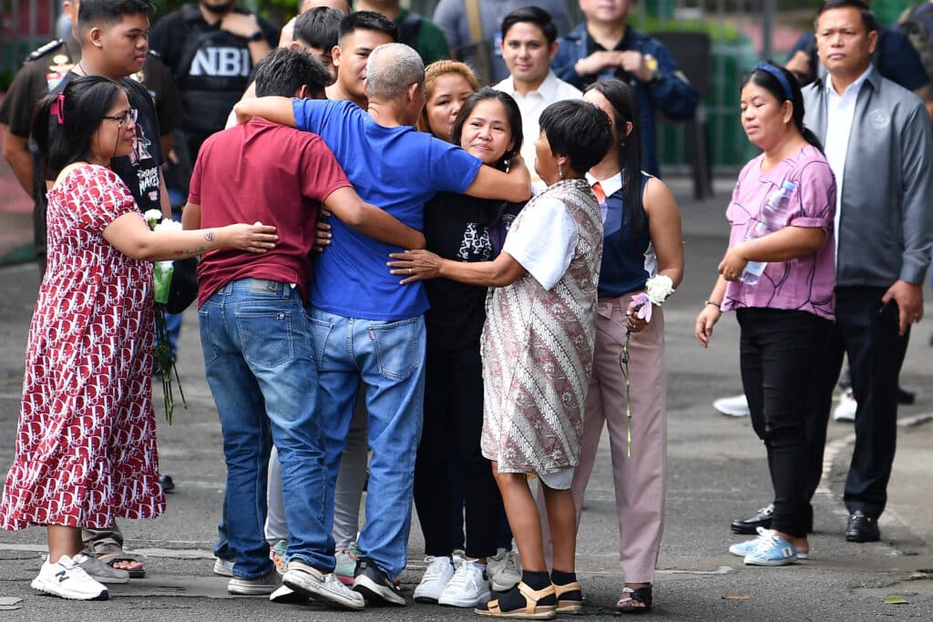 Mary Jane Veloso (center facing camera) meets her family after arriving at the Correctional Institution for Women in manila on December 18, 2024.| Photo by TED ALJIBE / AFP