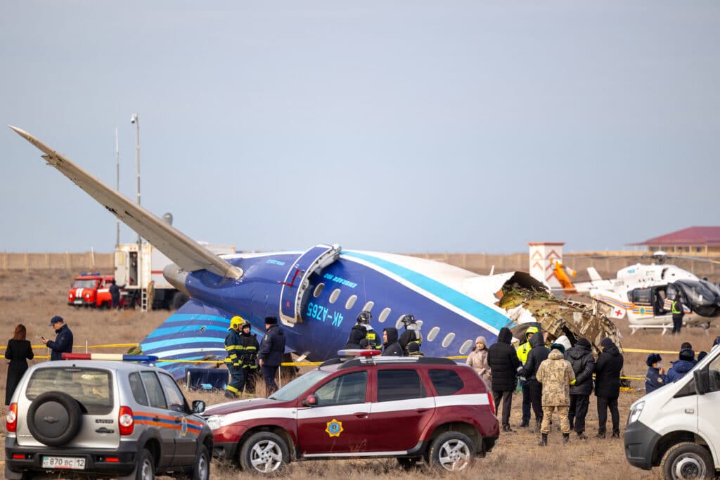 Emergency specialists work at the crash site of an Azerbaijan passenger jet near the western Kazakh city of Aktau on December 25, 2024. | Photo by Issa Tazhenbayev / AFP