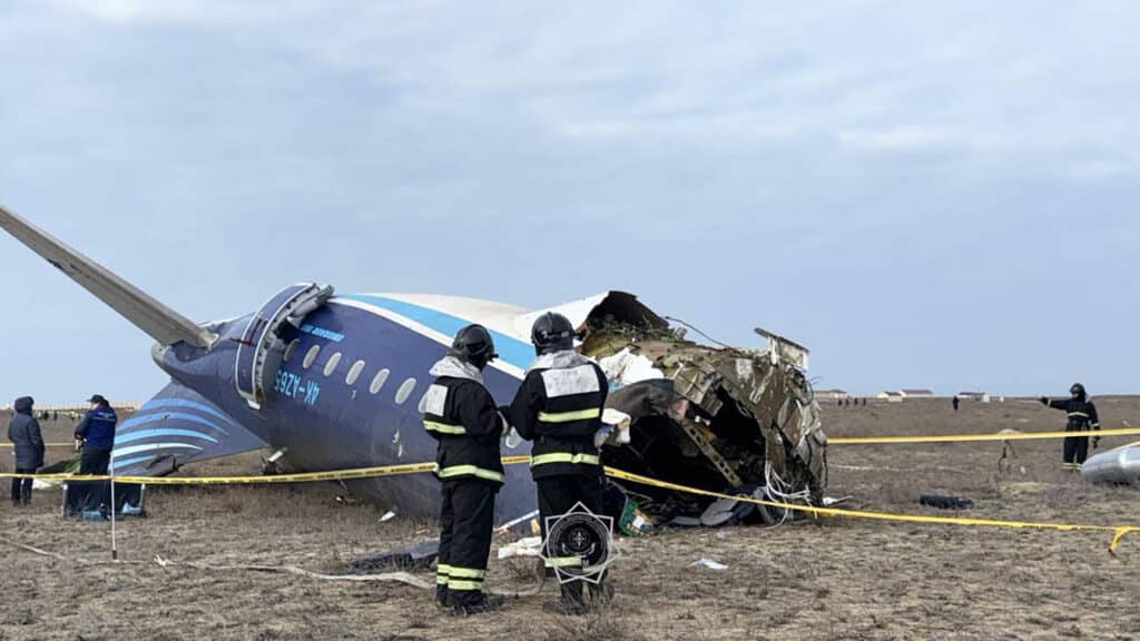 In this handout picture released by Kazakhstan's emergency situations ministry, emergency specialists work at the crash site of an Azerbaijan Airlines passenger jet near the western Kazakh city of Aktau on December 25, 2024. | Photo by Handout / Kazakhstan's emergency situations ministry / AFP