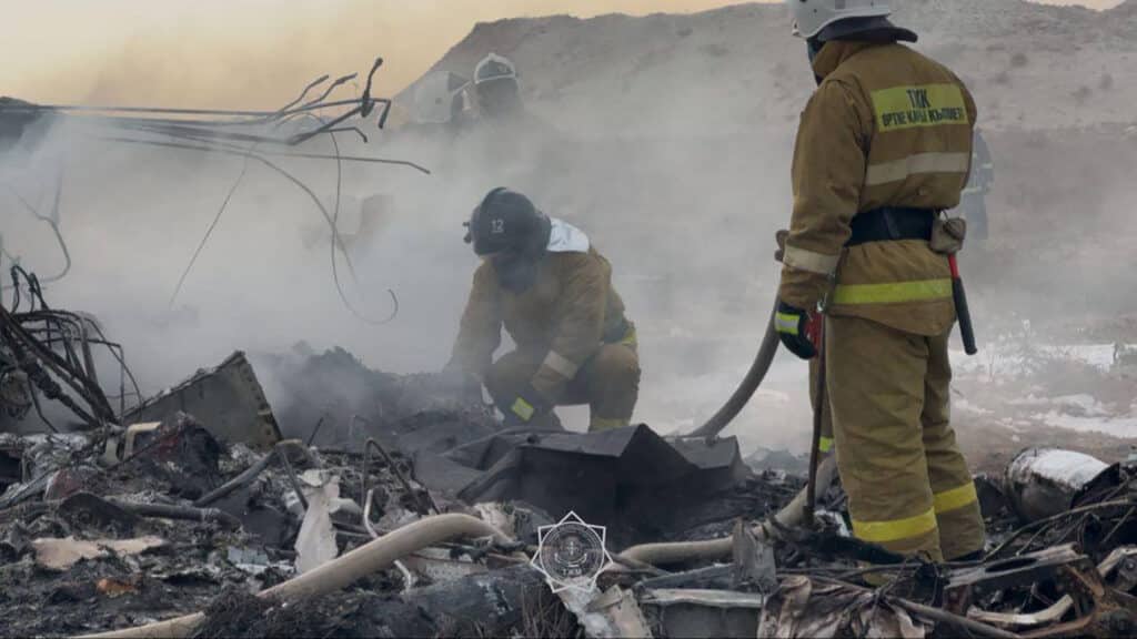 In this handout picture released by Kazakhstan's emergency situations ministry, emergency specialists work at the crash site of an Azerbaijan Airlines passenger jet near the western Kazakh city of Aktau on December 25, 2024. | Photo by Handout / Kazakhstan's emergency situations ministry / AFP