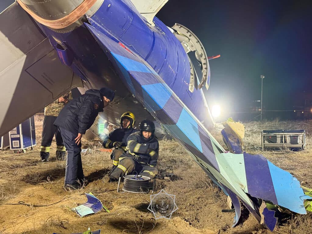 In this handout picture released by Kazakhstan's emergency situations ministry, emergency specialists work at the crash site near the western Kazakh city of Aktau on December 25, 2024. | Photo by Handout / Kazakhstan's emergency situations ministry / AFP