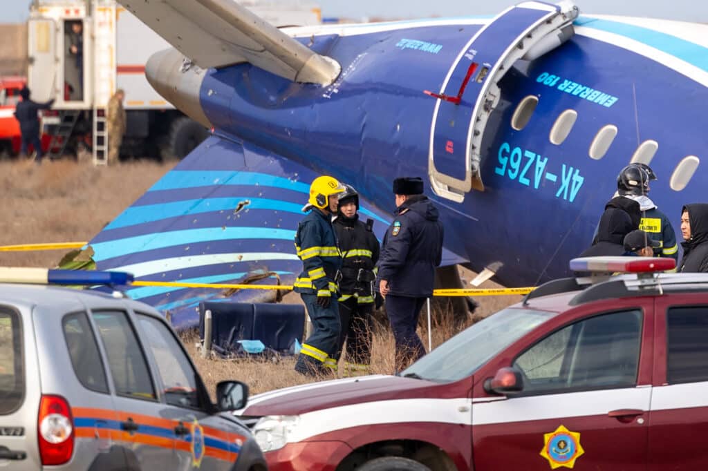 Emergency specialists work at the crash site of an Azerbaijan Airlines passenger jet near the western Kazakh city of Aktau on December 25, 2024. | Photo by Issa Tazhenbayev / AFP