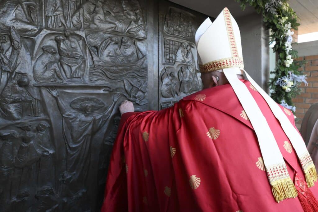 This photo taken and handout on December 26, 2024 by The Vatican Media shows Pope Francis opening a Holy Door at Rebibbia Penitentiary on Saint Stephen day in Rome as part of the Catholic Jubilee Year. | Photo by Handout / VATICAN MEDIA / AFP