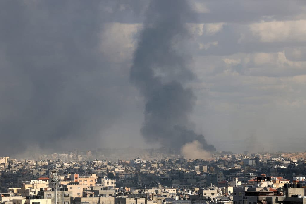 This picture taken from Gaza City shows smoke billowing after an Israeli strike in the north of the Palestinian territory on December 29, 2024, amid the ongoing war between Israel and the Palestinian Hamas movement. (Photo by Omar AL-QATTAA / AFP)