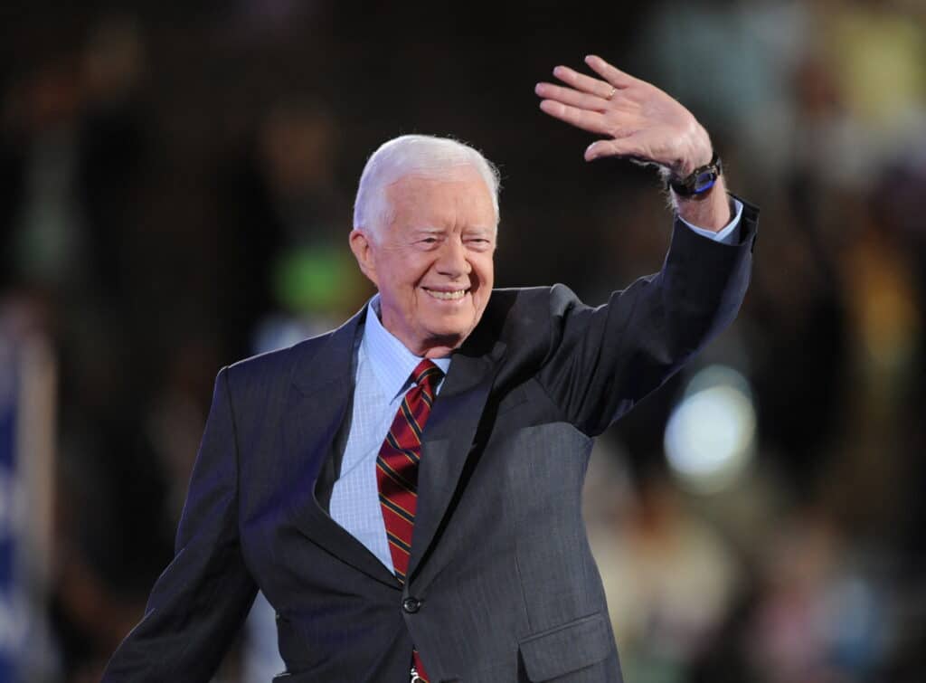 (FILES) Former President Jimmy Carter waves to the crowd at the Democratic National Convention 2008 at the Pepsi Center in Denver, Colorado, on August 25, 2008. - Jimmy Carter, the 100-year-old former US president and Nobel peace laureate who rose from humble beginnings in rural Georgia to lead the nation from 1977 to 1981, has died, his nonprofit foundation said December 29. (Photo by Robyn BECK / AFP)