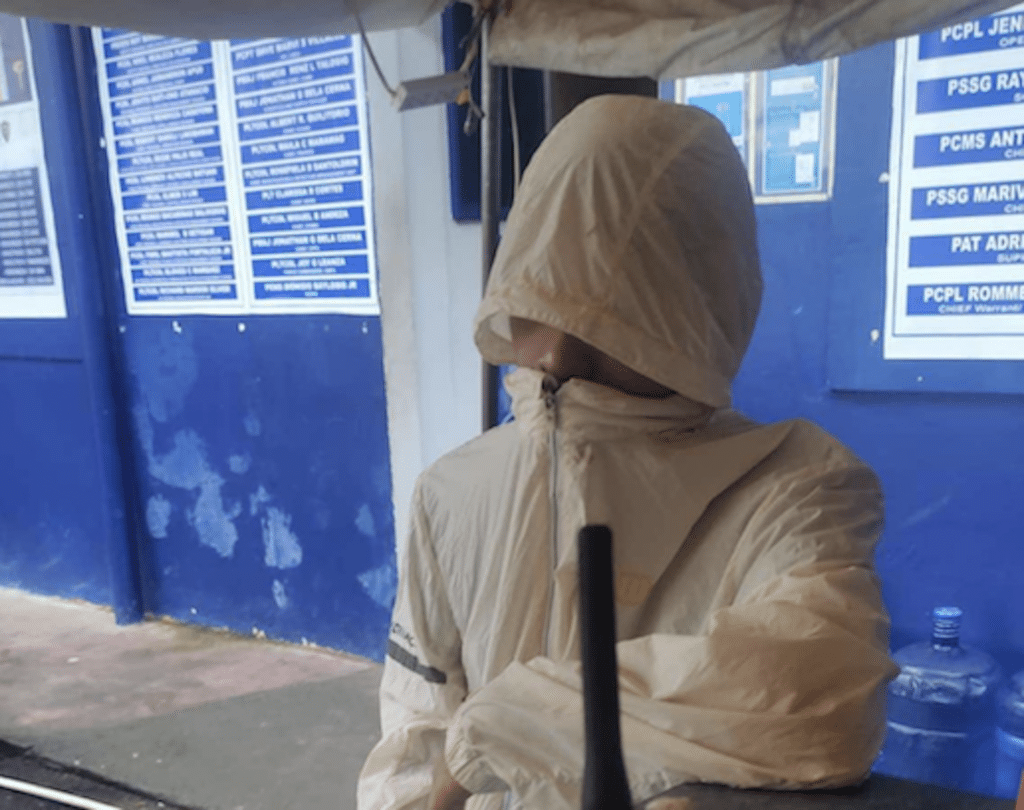 This is the 20-year-old promodiser, who was caught filming a woman inside a bathroom using his cell phone while she was taking a bath, is turned over to the Mambaling Police Station where he is detained pending the filing of charges. | Paul Lauro