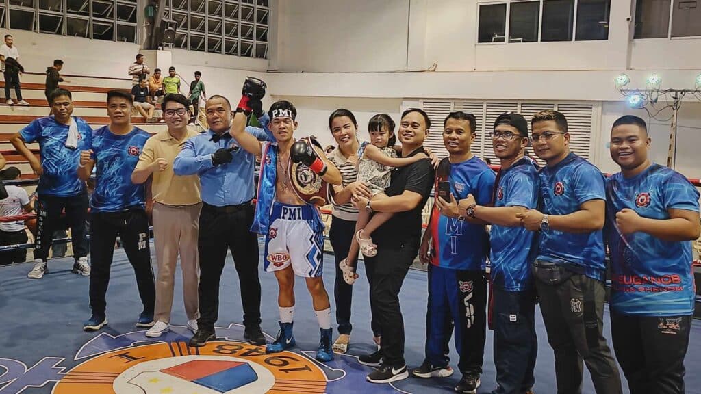 Regie Suganob celebrates with his team from the PMI Bohol Boxing Stable and Promotions. | By Glendale Rosal