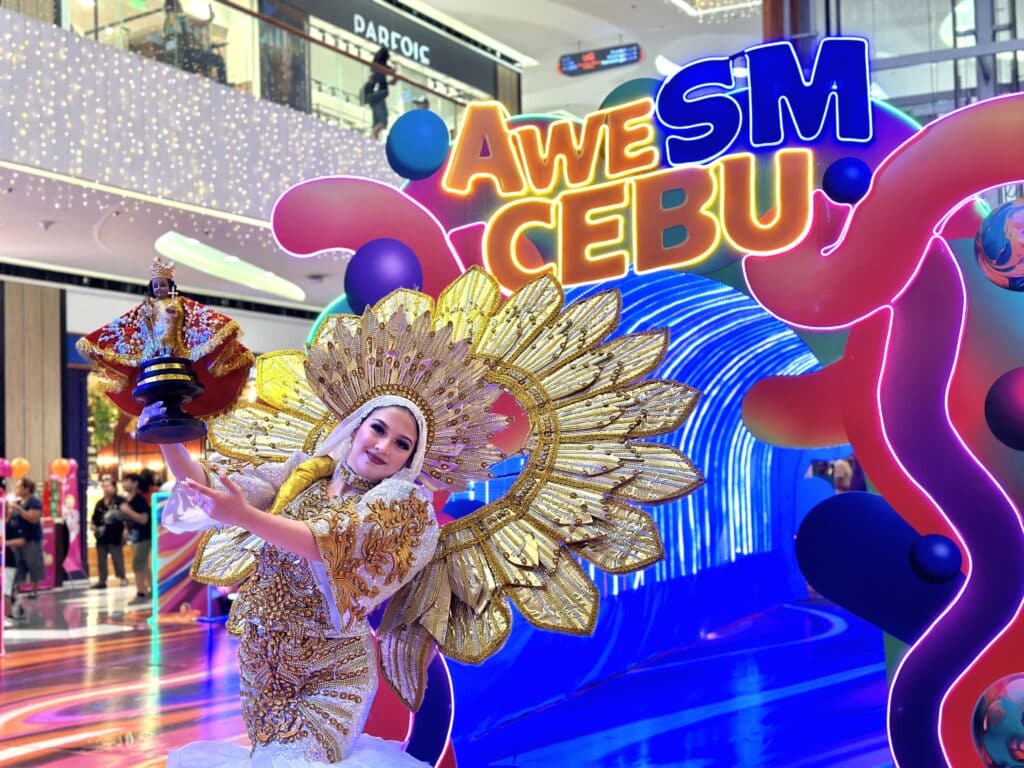 Sinulog festival queen dancing at the front of AweSM Cebu post