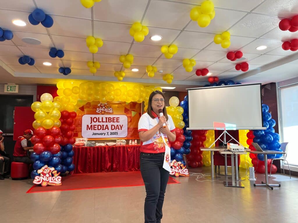 a Jollibee employee speaking in an event