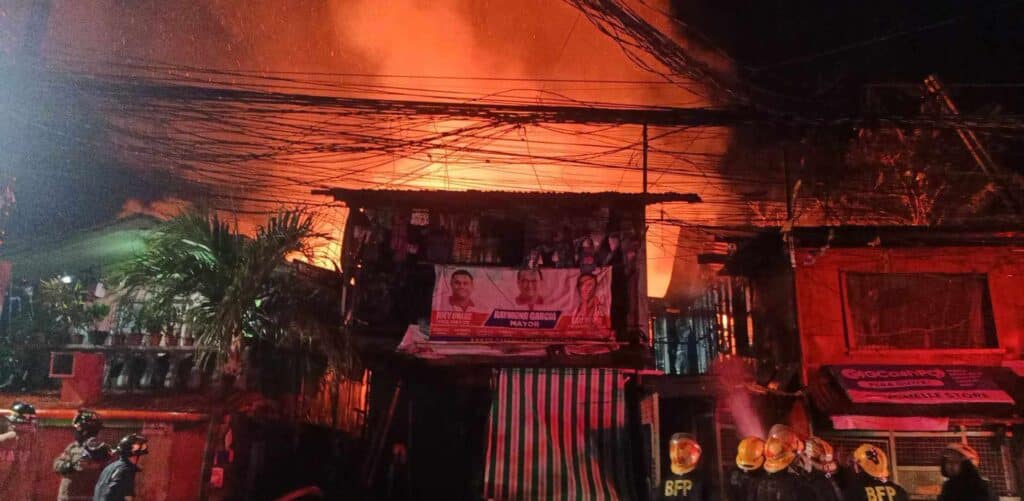 Cebu City fire leaves boy, 13, dead, 20 houses razed. Firefighters prayer to battle the fire that hit Barangay Duljo Fatima, Cebu City early this morning. | Paul Lauro