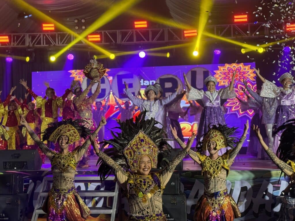 festival dancers perfoming in the stage