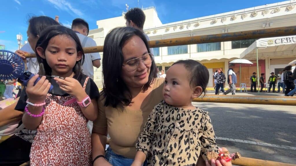 MJ and her two children. | Photo by Niña Mae Oliverio