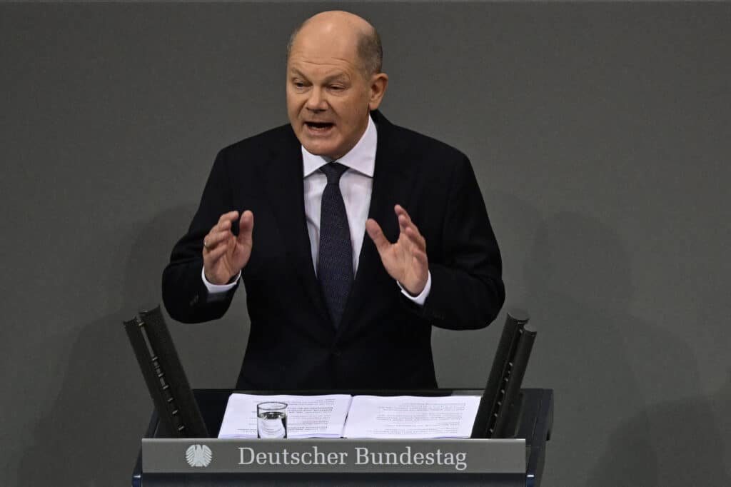 Musk helped Trump win, eyes Europe, alarms many politicians. In photo is German Chancellor Olaf Scholz gesturing as he addresses the Bundestag (Lower house of Parliament) in Berlin on December 16, 2024, ahead of a no-confidence vote against himself. | Photo by John MACDOUGALL / AFP