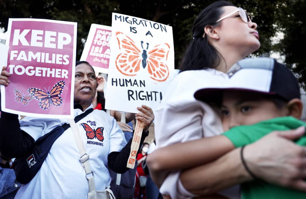 Trump campaign promises that come due on Day 1: Can he accomplish them? In photo are Immigrant rights supporters standing after marching to an ICE detention center on International Migrants Day on December 18, 2024 in Los Angeles, California. | Mario Tama/Getty Images/AFP [FILE PHOTO]