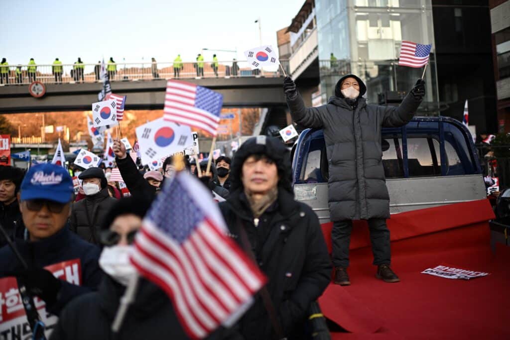 Investigators from the Corruption Investigation Office (CIO), which is probing Yoon's short-lived declaration of martial law, were let through heavy security barricades to enter the residence to attempt to execute their warrant to detain Yoon. (Photo by Philip FONG / AFP)