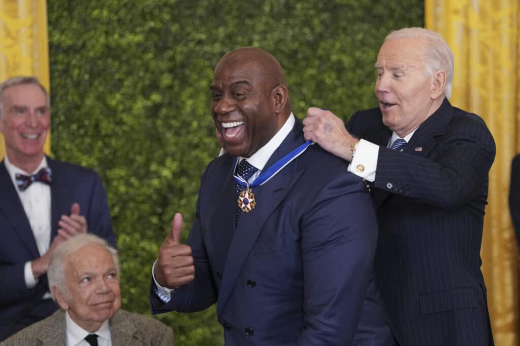 Retired basketball player and entrepreneur Earvin "Magic" Johnson and President Joe Biden.