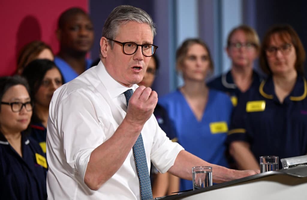 Britain's Prime Minister Keir Starmer delivers a speech on a plan to reduce NHS waiting times, during a visit to the South West London Elective Orthopaedic Centre (SWLEOC) in Epsom, south-west of London on January 6, 2025. (Photo by Leon Neal / POOL / AFP)