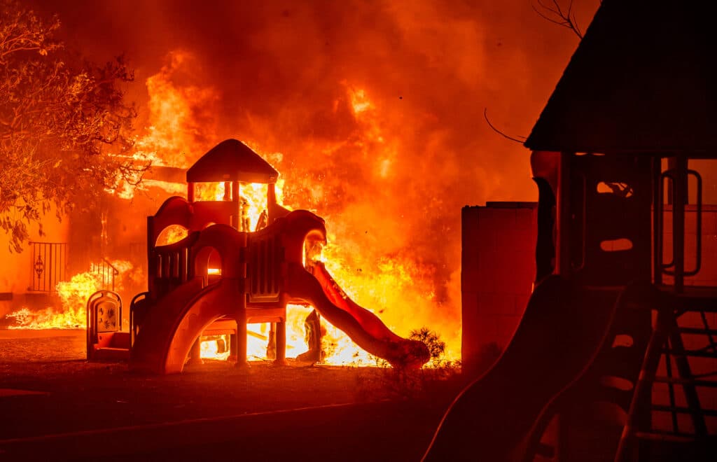 A playground burns in a residential neighborhood during the Eaton fire in Pasadena, California on January 7, 2025. | Photo by JOSH EDELSON / AFP