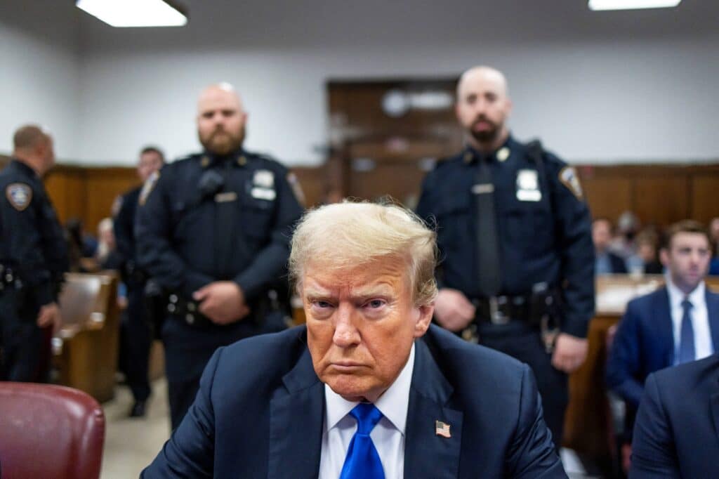 (FILES) Former US President Donald Trump sits at the defendant's table inside the courthouse as the jury is scheduled to continue deliberations for his hush money trial at Manhattan Criminal Court on May 30, 2024 in New York City. | Photo by Justin LANE / POOL / AFP