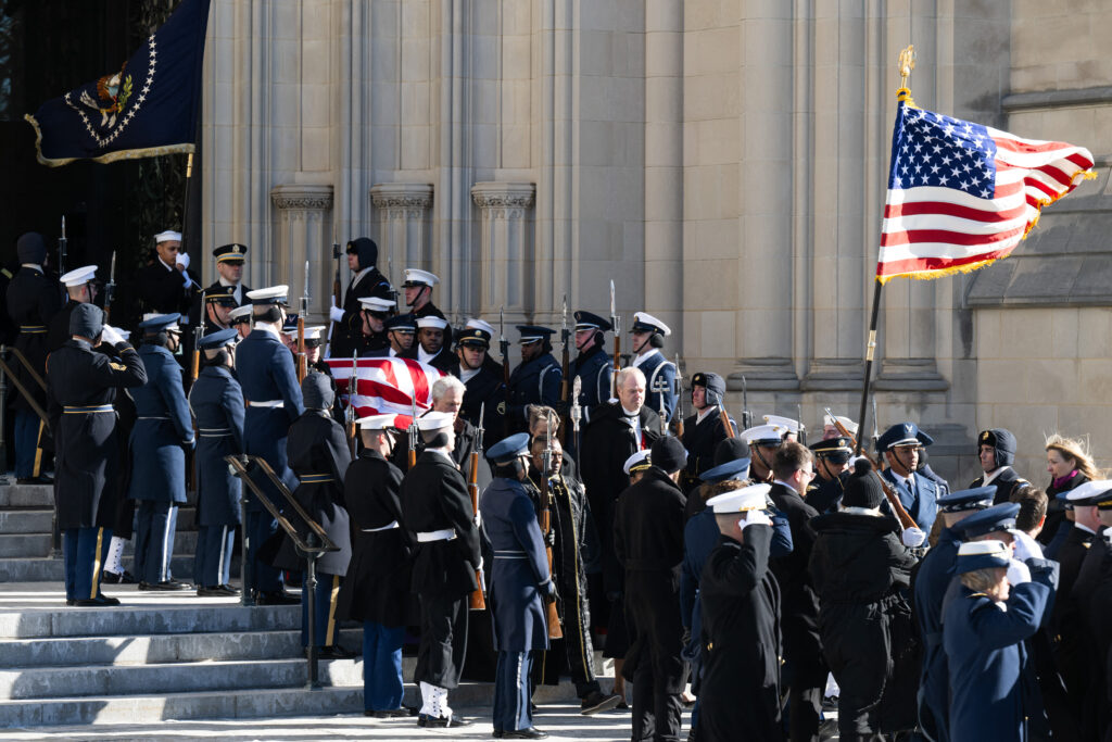 The remains of US President Carter are carried by an honor guard after a State Funeral Service at the Washington National Cathedral in Washington, DC, on January 9, 2025. (Photo by SAUL LOEB / POOL / AFP)