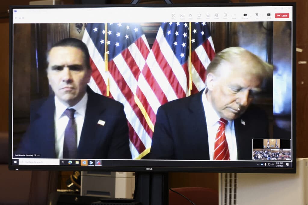 US judge spares Trump jail, fine for hush money conviction. Todd Blanche, attorney for former US President Donald Trump, and US President-elect Donald Trump are seen on the screen at Manhattan criminal court in New York, on January 10, 2025. | Photo by Brendan McDermid / POOL / AFP