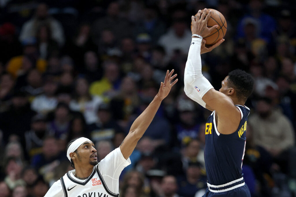 Russell Westbrook #4 of the Denver Nuggets puts up a shot over Keon Johnson #45 of the Brooklyn Nets in the first quarter at Ball Arena on January 10, 2025 in Denver, Colorado.| Matthew Stockman/Getty Images/AFP