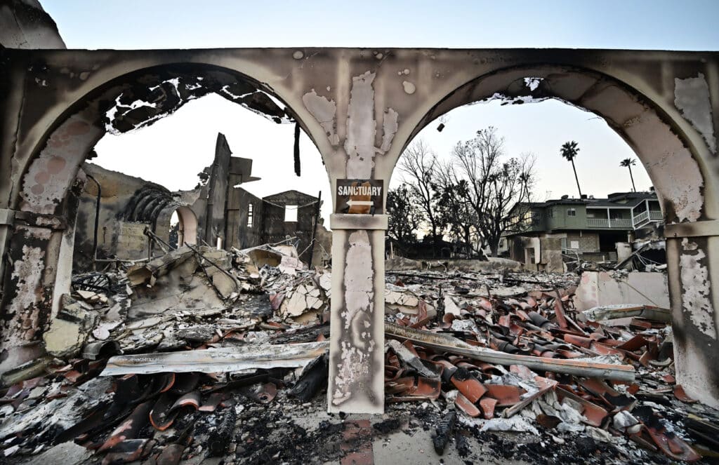 Los Angeles investigates fire blame as curfew enforced