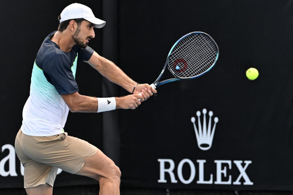 Habib makes history as first Lebanese to win Grand Slam match. In photo is Lebanon's Hady Habib hitting a shot against China's Bu Yunchaokete during their men's singles match on day one of the Australian Open tennis tournament in Melbourne on January 12, 2025.| Photo by Paul Crock / AFP