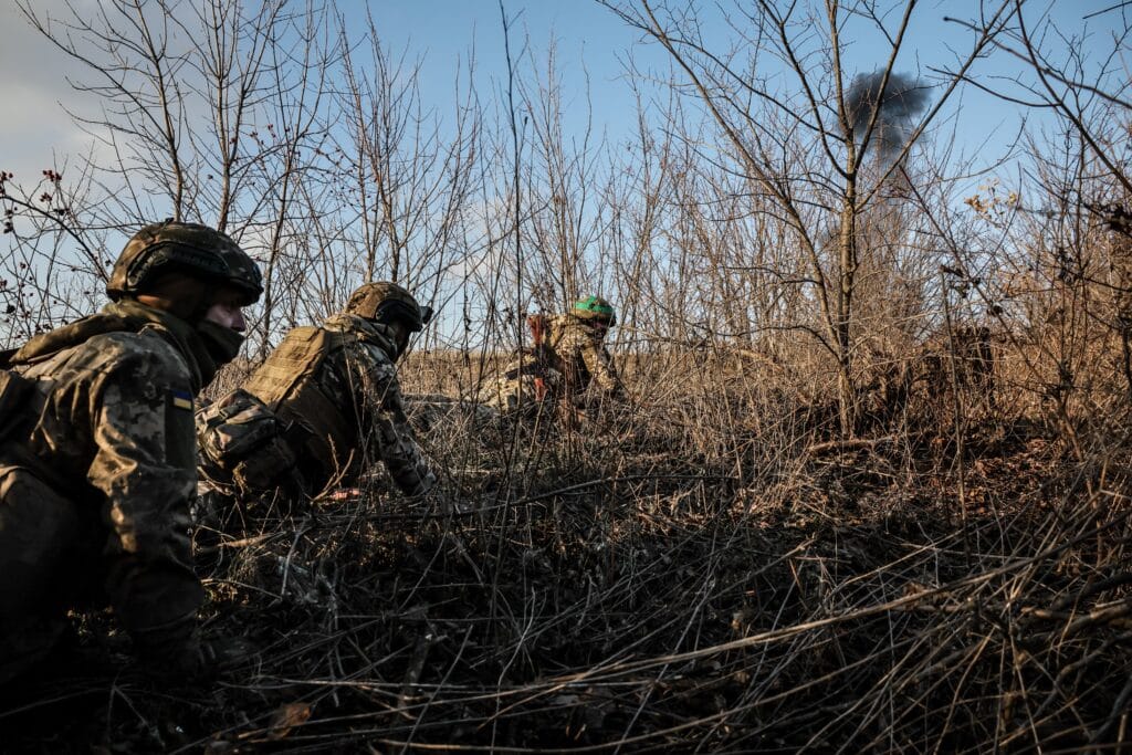 North Korean troops in the Ukraine war: What we know. This handout photograph taken on January 10, 2025 and released by the press service of the 24th Mechanized Brigade of Ukrainian Armed Forces on January 13, 2025 shows servicemen of engineer supply group of 24th Mechanized Brigade taking cover as smoke rising near Chasiv Yar town, in the Donetsk region, Ukraine. | Photo by Handout / 24th Mechanized Brigade of Ukrainian Armed Forces / AFP