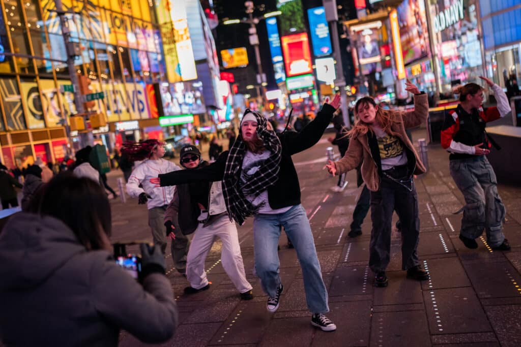 Members of the Studio1 dance group dance and record videos to be used for social media, including TikTok, in Times Square on January 14, 2025 in New York City. | Adam Gray/Getty Images/AFP