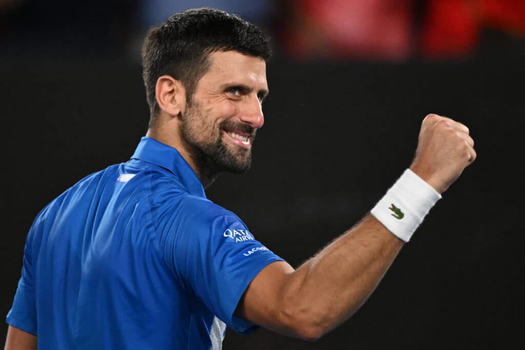 Djokovic makes tennis history for most Grand Slam matches played. Serbia's Novak Djokovic celebrates after victory against Portugal's Jaime Faria during their men's singles match on day four of the Australian Open tennis tournament in Melbourne on January 15, 2025. | Photo by WILLIAM WEST / AFP