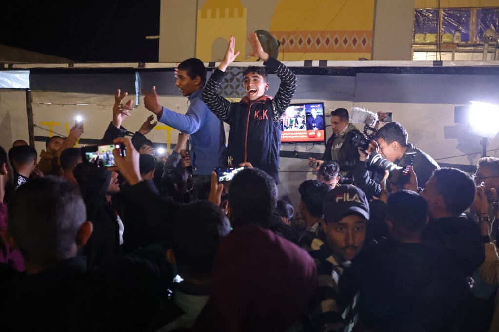 Thousands of Gazans celebrate on January 15 as news spread that a ceasefire and hostage release deal had been reached between Israel and Hamas, aimed at ending more than 15 months of war in the Palestinian territory. (Photo by BASHAR TALEB / AFP)