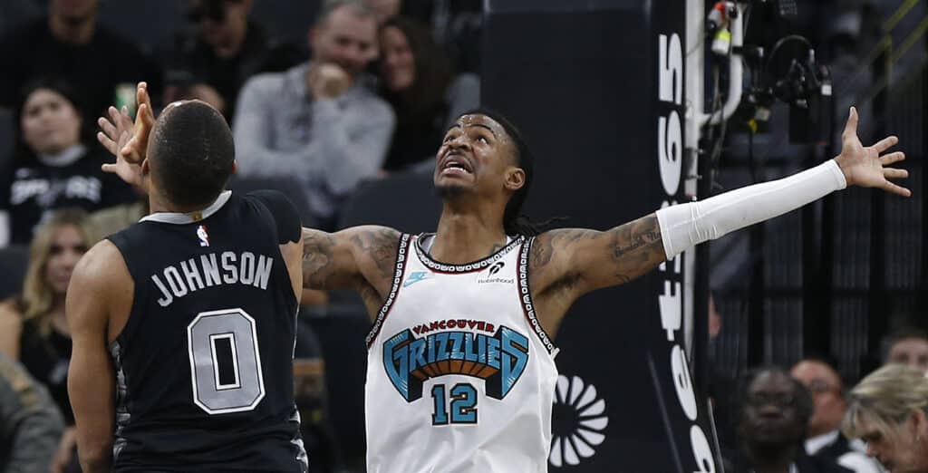 NBA: Grizzlies led by Morant’s 21 points beat Wembanyama and Spurs. Ja Morant #12 of the Memphis Grizzlies watches a shot by the San Antonio Spurs in the first half at Frost Bank Center on January 15, 2025 in San Antonio, Texas. | Ronald Cortes/Getty Images/AFP