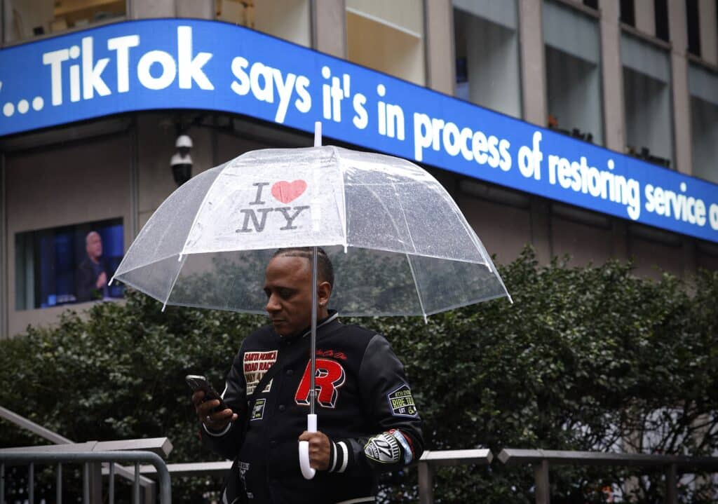 A display shows information about TikTok outside the Fox News building in New York City on January 19, 2025. TikTok restored service in the United States Sunday after briefly going dark, as a law banning the wildly popular app on national security grounds came into effect. | Photo by Kena Betancur / AFP