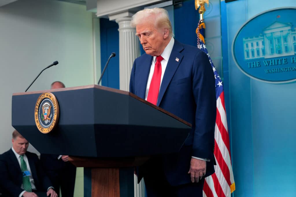 U.S. President Donald Trump takes a moment of silence before he speaks to reporters about the collision of an American Airlines flight with a military Black Hawk helicopter near Ronald Reagan National Airport, in the Brady Press Briefing Room at the White House on January 30, 2025 in Washington, DC.| Chip Somodevilla/Getty Images/AFP