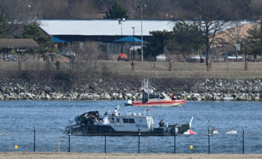 Helicopter-plane collision kills 67: US worst disaster in a generation . In photo is a police boat gathering wreckage along the Potomac River after American Airlines flight 5342 on approach to Reagan National Airport crashed into the river after colliding with a US Army helicopter, near Washington, DC, on January 30, 2025. | Photo by PEDRO UGARTE / AFP