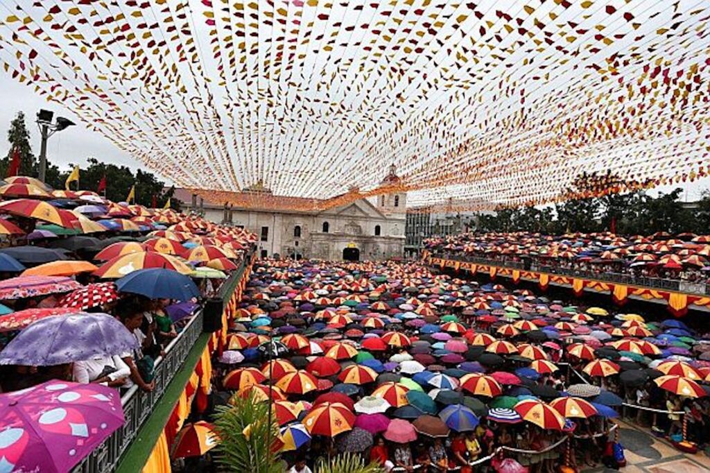 Sinulog weather. Umbrellas shield devotees who brave the rainy weather to attend one of the Novena Masses at the Basilica Minore del Sto. Niño during the Fiesta Señor in January. (CDN File Photo)