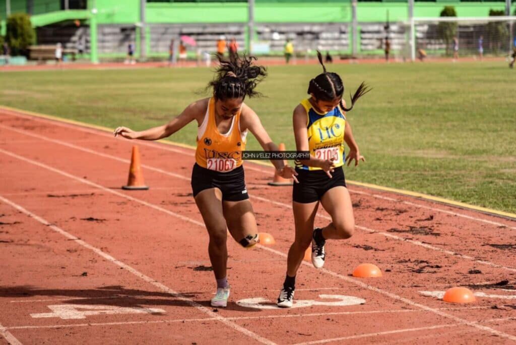 PRISAA Region 7 Games take center stage this weekend in Cebu. In photo are UC and USC sprinters crossing the finish line during the Cesafi Season 24 athletics event. | Photo from John Velez