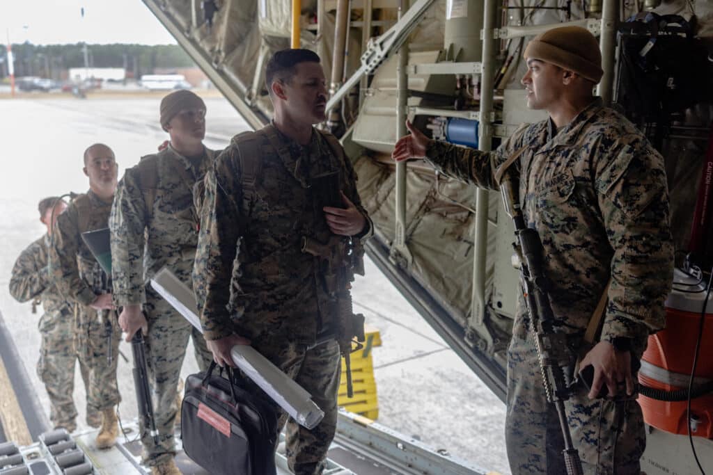 This image obtained from the US Department of Defense shows US Marines boarding a KC-130J Super Hercules at Marine Corps Air Station Cherry Point, North Carolina, on February 2, 2025, as they deploy to Naval Station Guantanamo Bay in Cuba to support Migrant Holding Operations.| Photo by Orlanys Diaz Figueroa / US Department of Defense / AFP