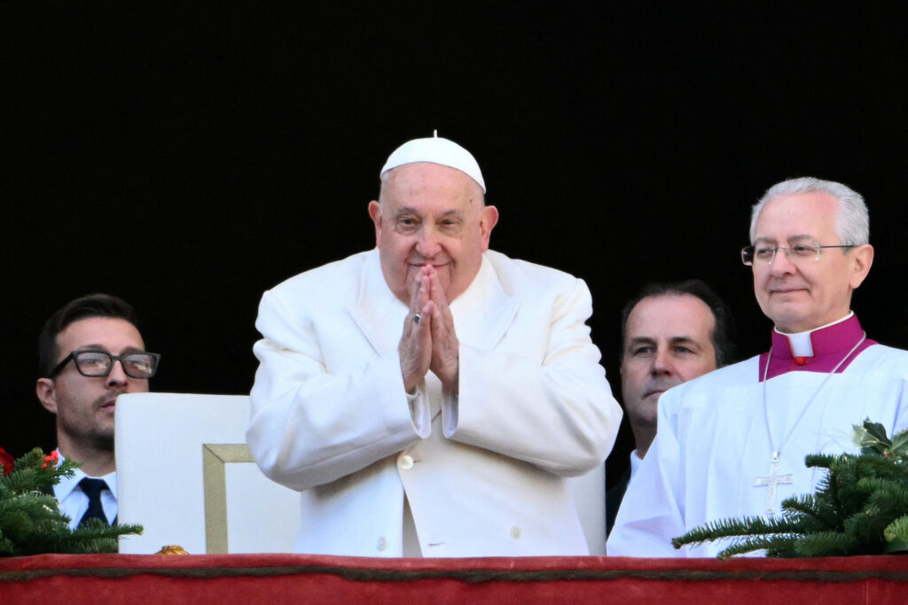 (FILES) Pope Francis' conditions are showing a "slight improvement", the Vatican said on February 24, 2025, as the critically-ill 88-year-old pontiff with double pneumonia spent his 11th day in hospital. In photo is Pope Francis greeting the crowd the crowd at St Peter's square in the Vatican on December 25, 2024. (Photo by Alberto PIZZOLI / AFP)