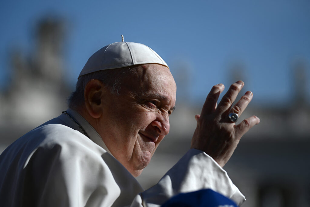 (FILES) Pope Francis "spent calm night, is resting", the Vatican said in the morning update on February 28, 2025. Pope Francis's condition was continuing to improve, as the 88-year-old pontiff marked two weeks in hospital with pneumonia in both lungs. In photo is Pope Francis waving to the crowd during the weekly general audience on March 20, 2024 at St Peter's square in The Vatican.  (Photo by Filippo MONTEFORTE / AFP)