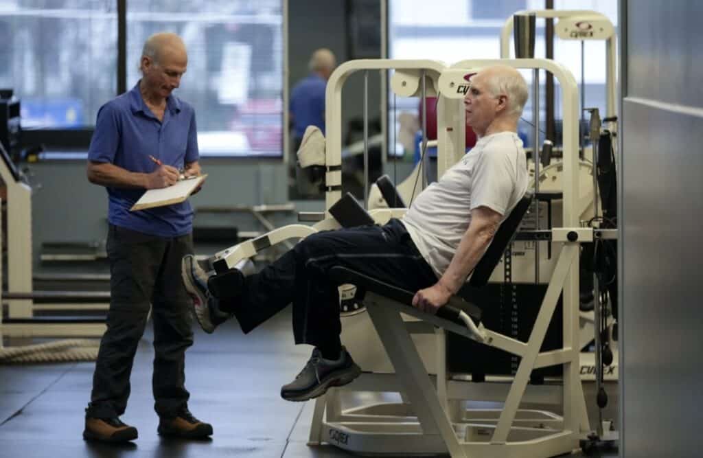 Dr. Grover Smith, right, works out with exercise scientist Dr. Irv Rubenstein, left, at STEPS Fitness, Wednesday, Feb. 12,2025, in Nashville, Tenn. (AP Photo/George Walker IV)