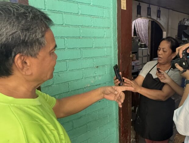 Tino: Residents nail door to keep floodwaters out in Brgy. Guadalupe